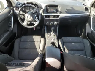 2016 Mazda CX-5 Touring z VIN JM3KE2CY5G0617516, wystawiony jako Copart lot #56421005 z przebiegiem 110 739 mil mil oraz Szkoda całkowita • Salvage title. Historia ofert i sprzedaży dostępna na DreamBid. Obrazek 8.