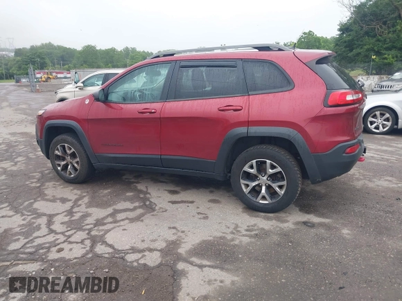 2015 Jeep Cherokee Trailhawk with VIN 1C4PJMBSXFW667469, listed as a IAAI auction lot 42438006 with 127,136 mi miles and . Bid and sale history available at DreamBid. Image 3.