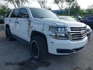 2019 Chevrolet Tahoe Commercial z VIN 1GNLCDECXKR196906, wystawiony jako IAAI lot #42370473 z przebiegiem 97 184 mil mil oraz . Historia ofert i sprzedaży dostępna na DreamBid. Obrazek 1.