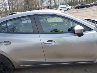 2016 Mazda Mazda3 i Sport with VIN JM1BM1T71G1335980, listed as a IAAI auction lot 42003186 with 131,015 mi miles. Bid and sale history available at carsss.com. Image 13.