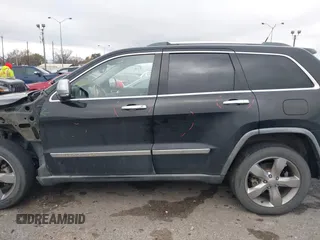 2011 Jeep Grand Cherokee Overland with VIN 1J4RS6GT7BC518123, listed as a IAAI auction lot 41277374 with 163,752 mi miles and . Bid and sale history available at DreamBid. Image 14.