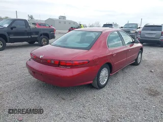 1999 Mercury Sable GS with VIN 1MEFM50U4XG622650, listed as a IAAI auction lot 42099721 with 86,899 mi miles. Bid and sale history available at carsss.com. Image 4.