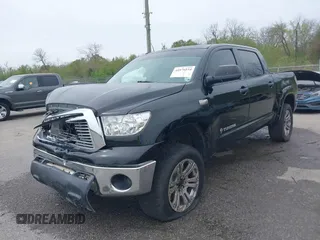 2011 Toyota Tundra 4WD Truck with VIN 5TFDW5F10BX166901, listed as a IAAI auction lot 41876554 with 207,187 mi miles. Bid and sale history available at carsss.com. Image 2.