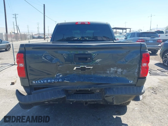 2018 Chevrolet Silverado 1500 LT with VIN 3GCUKREC1JG511846, listed as a IAAI auction lot 42024170 with 121,532 mi miles and . Bid and sale history available at DreamBid. Image 6.
