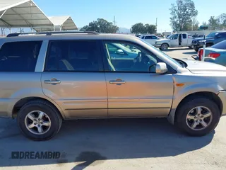 2006 Honda Pilot EX with VIN 5FNYF28416B017534, listed as a IAAI auction lot 41656789 with 241,343 mi miles and . Bid and sale history available at DreamBid. Image 13.