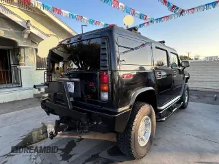 2003 Hummer H2 with VIN 5GRGN23U23H145183, listed as a Copart auction lot 84566884 with 85,945 mi miles and Clean Title. Bid and sale history available at carsss.com. Image 4.