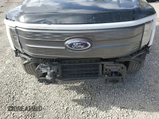 2022 Ford F-150 Lightning Pro z VIN 1FT6W1EV4NWG14041, wystawiony jako Copart lot #85252844 z przebiegiem 31 093 mil mil oraz Szkoda całkowita • Salvage title. Historia ofert i sprzedaży dostępna na DreamBid. Obrazek 11.