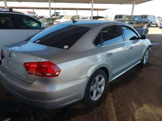 2014 Volkswagen Passat Wolfsburg Ed with VIN 1VWAT7A38EC051892, listed as a IAAI auction lot 41523058 with 122,493 mi miles. Bid and sale history available at carsss.com. Image 4.