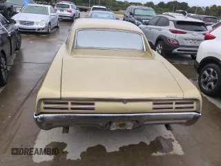 1967 Pontiac GTO z VIN 242077Z108825, wystawiony jako Copart lot #74747314 z przebiegiem 84 793 mil mil oraz Szkoda całkowita • Salvage title. Historia ofert i sprzedaży dostępna na DreamBid. Obrazek 6.