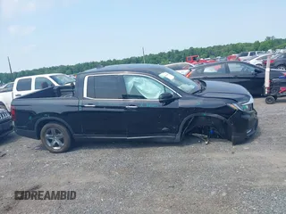 2023 Honda Ridgeline RTL-E with VIN 5FPYK3F71PB022739, listed as a IAAI auction lot 42447428 with 19,702 mi miles and . Bid and sale history available at DreamBid. Image 13.