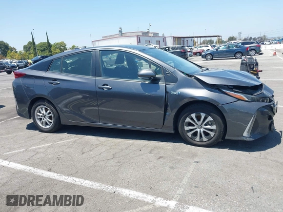 2021 Toyota Prius LE with VIN JTDKAMFPXM3170372, listed as a IAAI auction lot 42661609 with 47,977 mi miles and . Bid and sale history available at DreamBid. Image 13.