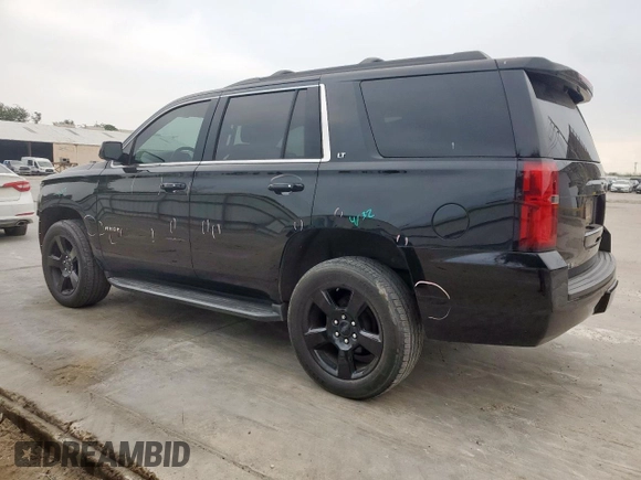 2020 Chevrolet Tahoe LT with VIN 1GNSCBKC5LR203301, listed as a Copart auction lot 57071315 with 106,376 mi miles and Salvage title. Bid and sale history available at DreamBid. Image 2.