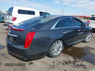 2013 Cadillac XTS Luxury with VIN 2G61P5S31D9182553, listed as a IAAI auction lot 42076227 with 116,849 mi miles and . Bid and sale history available at DreamBid. Image 4.