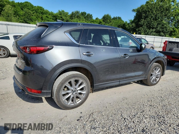2020 Mazda CX-5 Grand Touring z VIN JM3KFADM2L0803589, wystawiony jako Copart lot #61916825 z przebiegiem 63 663 mil mil oraz Szkoda całkowita • Salvage title. Historia ofert i sprzedaży dostępna na DreamBid. Obrazek 3.