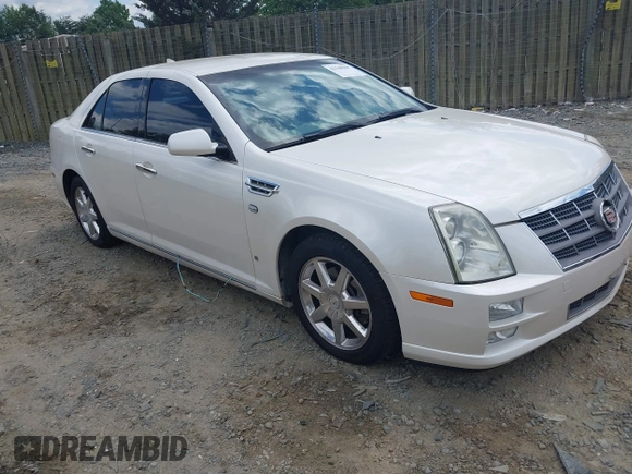 2010 Cadillac STS AWD z VIN 1G6DU6EV4A0102872, wystawiony jako IAAI lot #42348505 z przebiegiem 151 934 mil mil oraz . Historia ofert i sprzedaży dostępna na DreamBid. Obrazek 1.