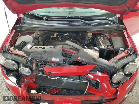 2012 Chevrolet Sonic LT z VIN 1G1JC5SH3C4140111, wystawiony jako Copart lot #57206595 z przebiegiem 126 223 mil mil oraz Szkoda całkowita • Salvage title. Historia ofert i sprzedaży dostępna na DreamBid. Obrazek 11.