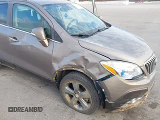2014 Buick Encore Leather with VIN KL4CJCSB3EB739931, listed as a IAAI auction lot 41891726 with 113,473 mi miles and . Bid and sale history available at carsss.com. Image 6.