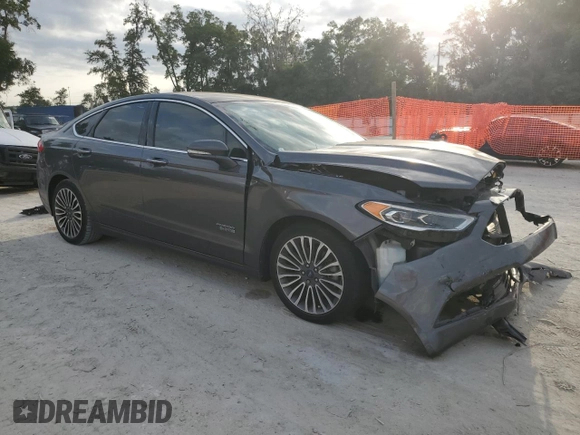 2017 Ford Fusion Titanium z VIN 3FA6P0SU0HR290201, wystawiony jako Copart lot #60106095 z przebiegiem 98 086 mil mil oraz Szkoda całkowita • Salvage title. Historia ofert i sprzedaży dostępna na DreamBid. Obrazek 4.