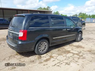 2015 Chrysler Town & Country Touring L with VIN 2C4RC1CG4FR509973, listed as a IAAI auction lot 42121743 with 199,183 mi miles and . Bid and sale history available at carsss.com. Image 4.