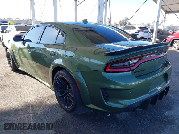 2022 Dodge Charger Scat Pack Widebody with VIN 2C3CDXGJ1NH216763, listed as a IAAI auction lot 41259159 with 32,610 mi miles and . Bid and sale history available at DreamBid. Image 3.