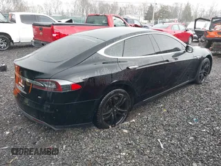 2014 Tesla Model S 60 with VIN 5YJSA1H18EFP28053, listed as a IAAI auction lot 41191521 with 82,207 mi miles and . Bid and sale history available at DreamBid. Image 4.