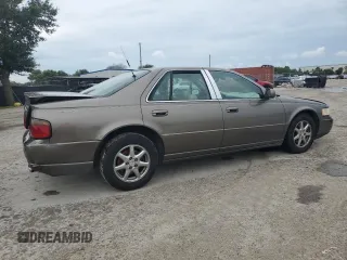 2002 Cadillac Seville Luxury SLS z VIN 1G6KS54Y72U218452, wystawiony jako Copart lot #71632784 z przebiegiem 99 563 mil mil oraz Szkody całkowita. Historia ofert i sprzedaży dostępna na DreamBid. Obrazek 3.