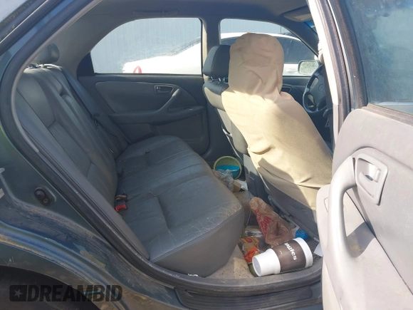2000 Toyota Camry CE z VIN JT2BG22K5Y0476098, wystawiony jako IAAI lot #42200385 z przebiegiem Nie podano mil oraz . Historia ofert i sprzedaży dostępna na DreamBid. Obrazek 8.