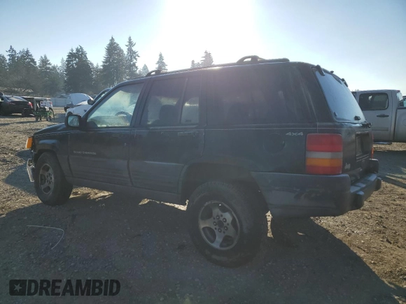 1998 Jeep Grand Cherokee Laredo with VIN 1J4GZ58S0WC106148, listed as a Copart auction lot 42855105 with 263,785 mi miles and Salvage Title. Bid and sale history available at carsss.com. Image 2.