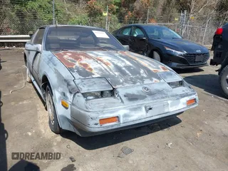 1986 Nissan 300ZX z VIN JN1HZ14S8GX165552, wystawiony jako IAAI lot #41920519 z przebiegiem Nie podano mil oraz . Historia ofert i sprzedaży dostępna na DreamBid. Obrazek 1.
