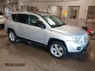 2011 Jeep Compass with VIN 1J4NT1FBXBD260990, listed as a IAAI auction lot 41540649 with 152,385 mi miles. Bid and sale history available at carsss.com. Image 1.