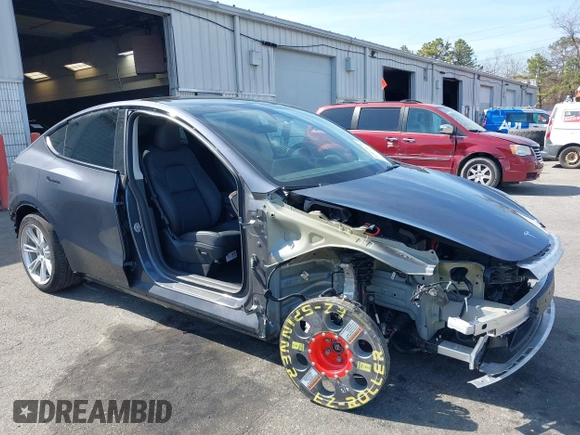 2023 Tesla Model Y Long Range with VIN 7SAYGDEE7PF856985, listed as a IAAI auction lot 42097675 with 13,112 mi miles and . Bid and sale history available at DreamBid. Image 6.