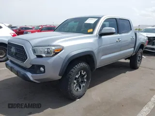 2018 Toyota Tacoma SR5 with VIN 3TMAZ5CN0JM053861, listed as a IAAI auction lot 41920377 with 104,015 mi miles and . Bid and sale history available at DreamBid. Image 2.
