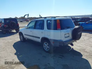 2000 Honda CR-V EX with VIN JHLRD1869YS000284, listed as a IAAI auction lot 41735106 with 160,956 mi miles. Bid and sale history available at carsss.com. Image 3.
