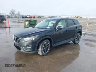 2016 Mazda CX-5 Grand Touring with VIN JM3KE4DY3G0769448, listed as a IAAI auction lot 41947725 with 154,051 mi miles and . Bid and sale history available at carsss.com. Image 2.