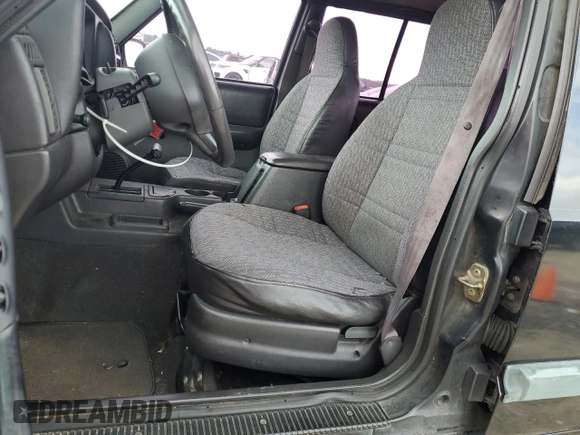 2000 Jeep Cherokee with VIN 1J4FT48S3YL139915, listed as a Copart auction lot 69840924 with 249,720 mi miles and Salvage title. Bid and sale history available at DreamBid. Image 7.