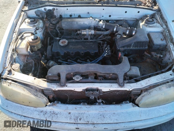 1997 Hyundai Accent z VIN KMHVF24NXVU373676, wystawiony jako Copart lot #77866484 z przebiegiem 151 949 mil mil oraz Tytuł czysty. Historia ofert i sprzedaży dostępna na DreamBid. Obrazek 11.