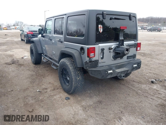 2013 Jeep Wrangler Unlimited Rubicon z VIN 1C4BJWFG7DL667083, wystawiony jako IAAI lot #42016912 z przebiegiem 148 933 mil mil oraz . Historia ofert i sprzedaży dostępna na DreamBid. Obrazek 3.