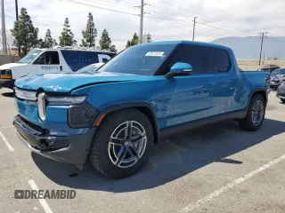2025 Rivian R1T Adventure with VIN 7FCTGBAA9SN035986, listed as a Copart auction lot 52921085 with 2,102 mi miles and Salvage Title. Bid and sale history available at carsss.com. Image 1.
