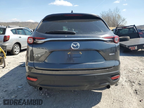 2021 Mazda CX-9 Touring z VIN JM3TCACY5M0500924, wystawiony jako Copart lot #50654505 z przebiegiem 57 067 mil mil oraz Szkoda całkowita • Salvage title. Historia ofert i sprzedaży dostępna na DreamBid. Obrazek 6.
