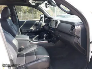 2020 Toyota Tacoma 4WD SR5 with VIN 3TMCZ5AN3LM309635, listed as a IAAI auction lot 41598363 with 99,080 mi miles. Bid and sale history available at carsss.com. Image 5.