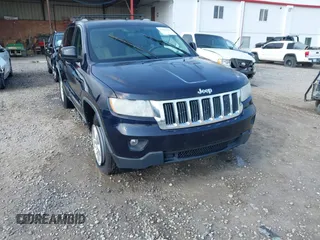 2011 Jeep Grand Cherokee Laredo with VIN 1J4RR4GG5BC622628, listed as a IAAI auction lot 42402893 with 163,731 mi miles and . Bid and sale history available at DreamBid. Image 1.