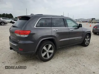 2014 Jeep Grand Cherokee Overland with VIN 1C4RJFCG9EC572237, listed as a Copart auction lot 53864865 with 90,657 mi miles and Salvage Title. Bid and sale history available at DreamBid. Image 3.