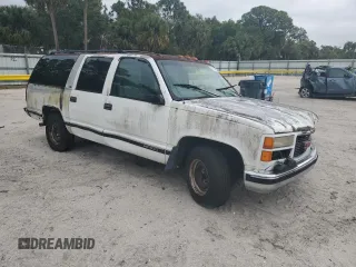 1997 GMC Suburban with VIN 1GKEC16R9VJ728883, listed as a Copart auction lot 52104265 with 246,816 mi miles and Salvage Title. Bid and sale history available at carsss.com. Image 4.