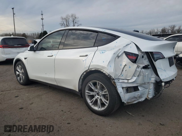 2023 Tesla Model Y Long Range with VIN 7SAYGDEE3PA130988, listed as a Copart auction lot 42172185 with 112,136 mi miles and Salvage Title. Bid and sale history available at DreamBid. Image 2.
