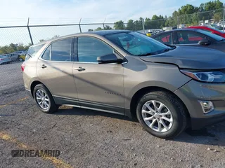 2018 Chevrolet Equinox LT z VIN 3GNAXJEV9JL115685, wystawiony jako IAAI lot #40373717 z przebiegiem 95 103 mil mil oraz . Historia ofert i sprzedaży dostępna na DreamBid. Obrazek 13.