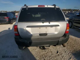 2004 Jeep Grand Cherokee Laredo with VIN 1J4GX48N74C406647, listed as a Copart auction lot 77631654 with 174,824 mi miles and Salvage Title. Bid and sale history available at carsss.com. Image 6.