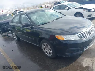 2010 Kia Optima LX with VIN KNAGG4A88A5398310, listed as a IAAI auction lot 41636123 with 215,403 mi miles. Bid and sale history available at carsss.com. Image 1.