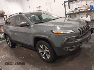 2015 Jeep Cherokee Trailhawk z VIN 1C4PJMBB4FW528633, wystawiony jako IAAI lot #42147632 z przebiegiem 166 669 mil mil oraz . Historia ofert i sprzedaży dostępna na DreamBid. Obrazek 1.