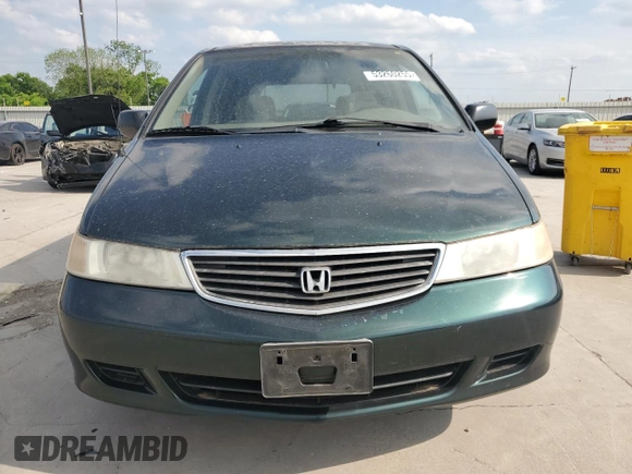 2000 Honda Odyssey LX z VIN 2HKRL1850YH575430, wystawiony jako Copart lot #53260255 z przebiegiem 188 847 mil mil oraz Szkoda całkowita • Salvage title. Historia ofert i sprzedaży dostępna na DreamBid. Obrazek 5.
