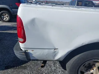 2003 Ford F-150 XL with VIN 1FTRF17W13NB65293, listed as a IAAI auction lot 41264978 with Not Provided miles and . Bid and sale history available at DreamBid. Image 12.